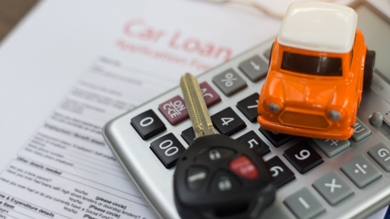 Car keys and Calculator on Top of Document