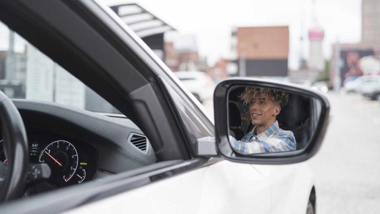 Young Man Driving Car