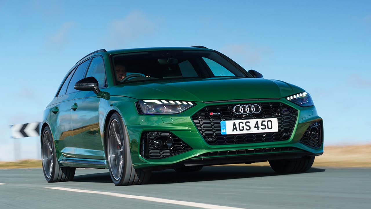 Green Audi RS4 Avant Driving On Road