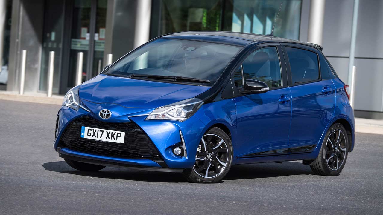 Head on shot of a blue Toyota Yaris