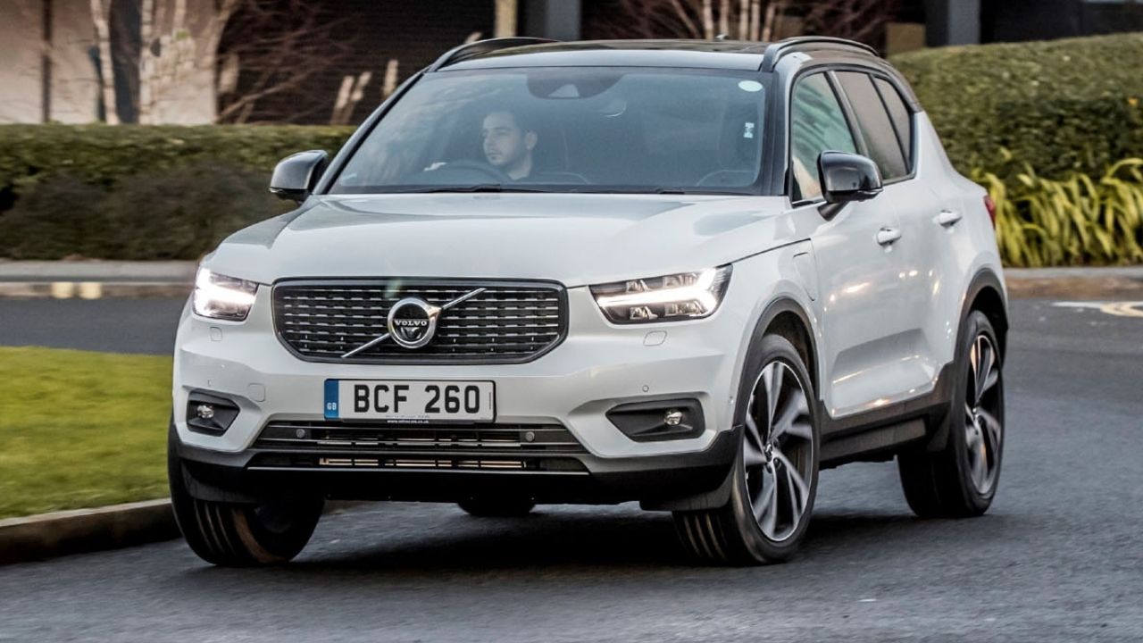 White Volvo XC40 driving on the road