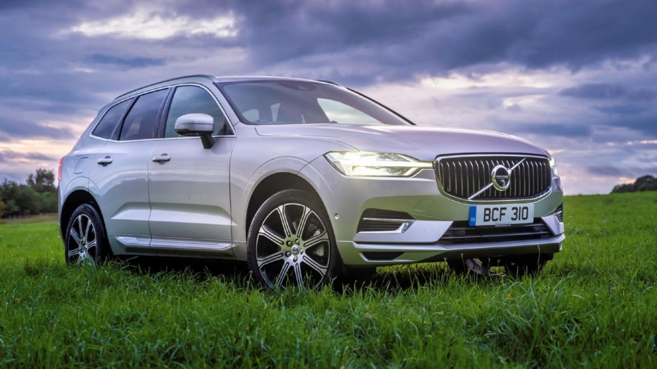 White Volvo XC40 parked on the grass