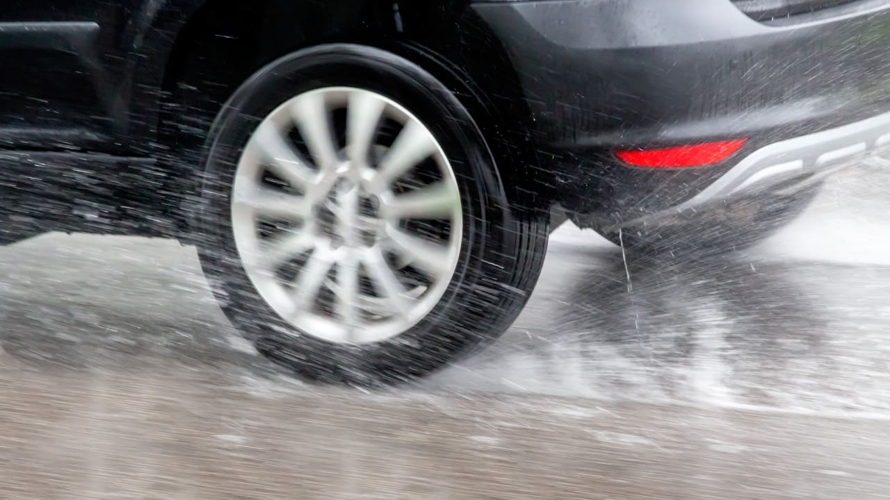 Car Driving Through Rain